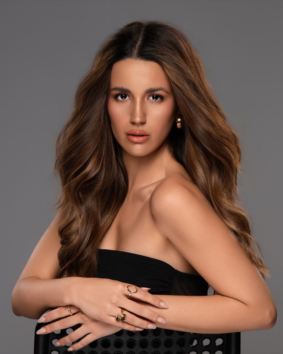 Model with long layered hair after a cut in the studio